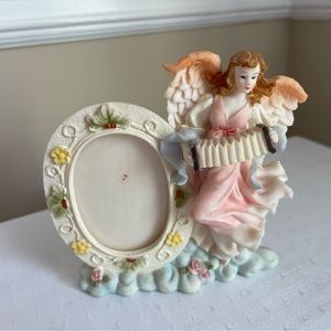 Angel goddess with oval picture frame